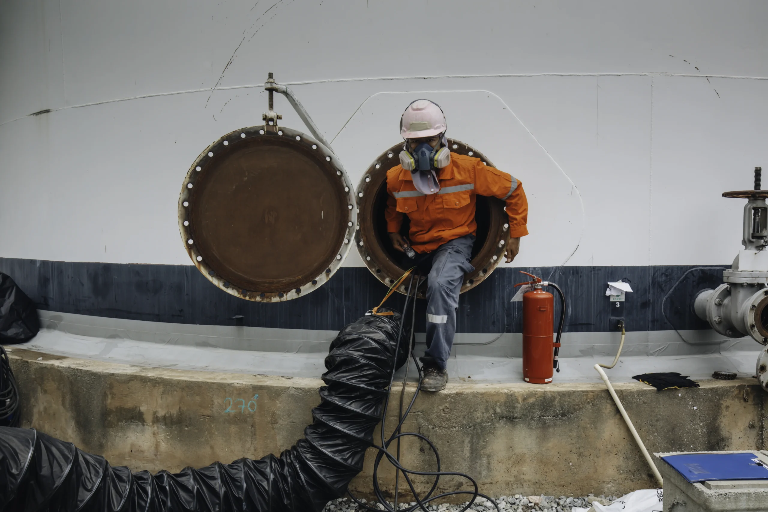 Man emerging from working in a confined space