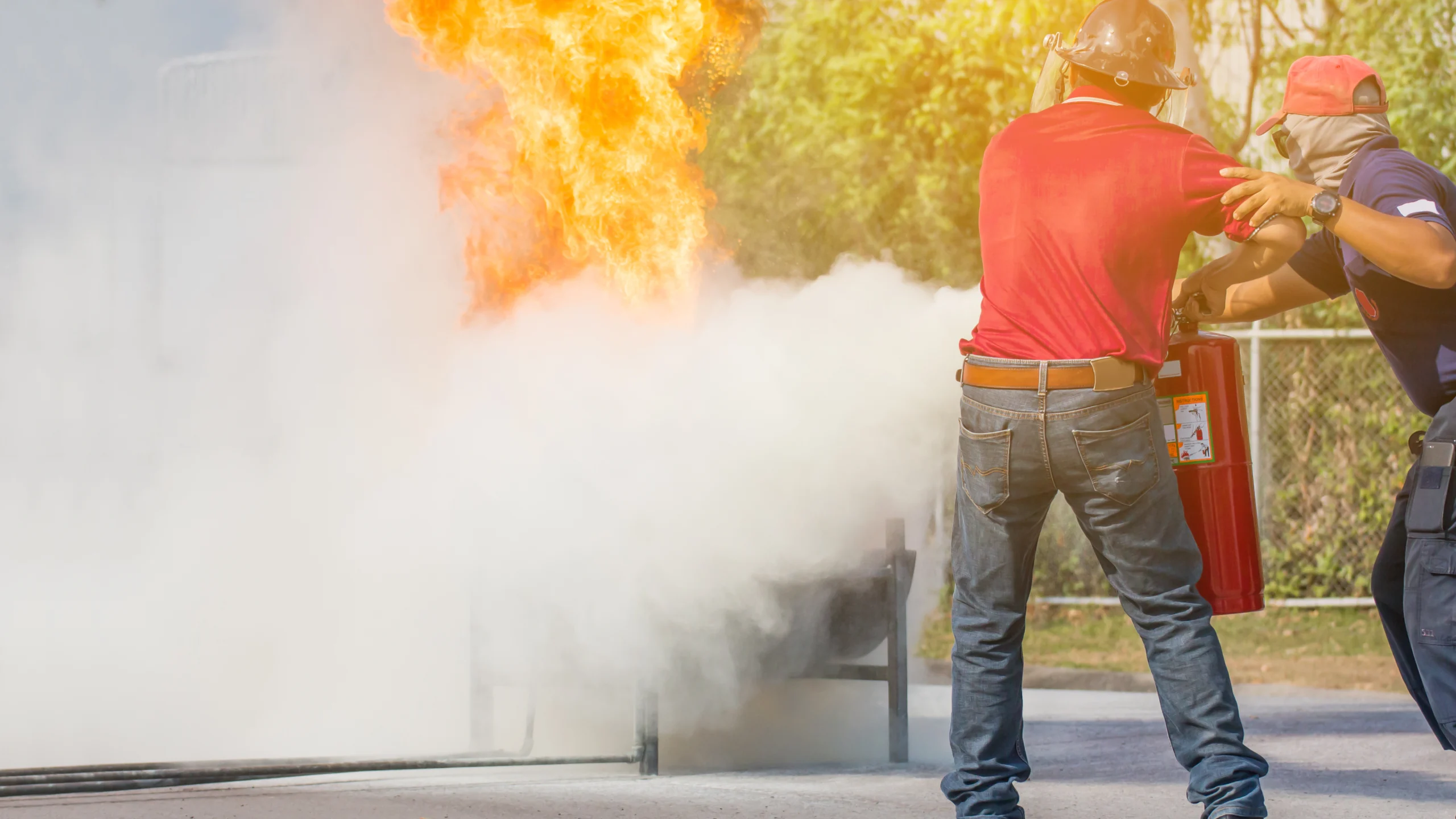 team learning how to use a fire extinguiser